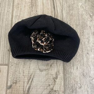 Baby leopard and black winter hat